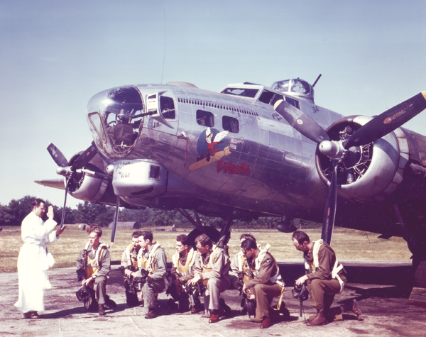The crew of the B-17 Fifinella pray with their chaplain before heading on a combat mission.