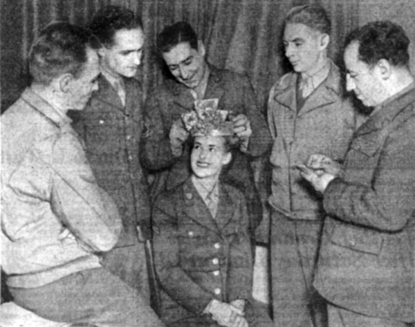 A panel of GI judges selected Cpl. Ruby Newell as the "the prettiest Wac in the United Kingdom." She was crowned during half-time of the Army-Navy football game in London.